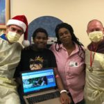 Dallas Children's Charities Laptop Delivery to Christopher